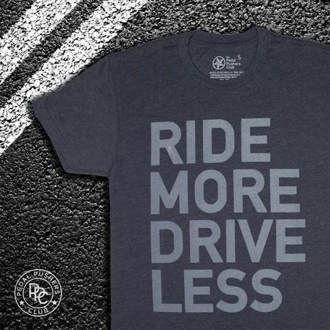 Dark gray t-shirt with light gray text: "RIDE MORE DRIVE LESS"
