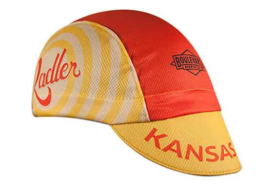 Boulevard Brewing Co. 3-Panel Technical Cycling Cap. Red and yellow cap with Boulevard logo, Radler text on side, Kansas City text on brim.  Angled view.