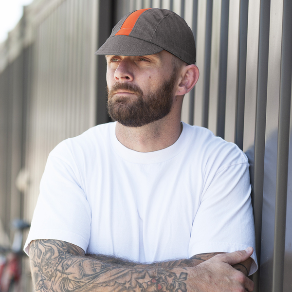 Man wearing collegiate fast cap.