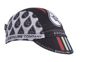 Kalamazoo Distilling Co. 3-Panel Technical Cycling Cap. Black and white cap with Kalamazoo Distilling Company imagery.  Angled view.