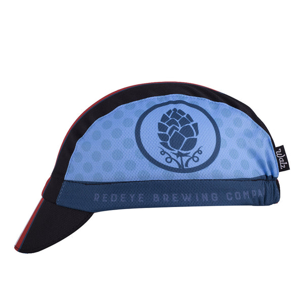 Red Eye Brewing Co. Technical 3-Panel Cycling Cap.  Blue and black cap with blue, white, and red stripes.  Red Eye brewing company imagery on side.  Side view.