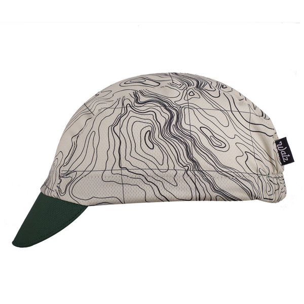 The "NPS" Trail Cap Technical 3-Panel Cap.  White topographic map design with green brim.  Side view.