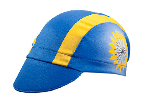 Kansas 3-Panel Technical Cycling Cap. Blue and yellow cap with sunflower imagery on the side.  Angled view.