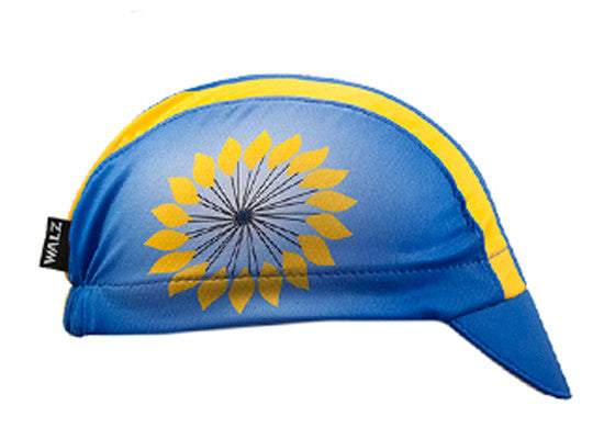 Kansas 3-Panel Technical Cycling Cap. Blue and yellow cap with sunflower imagery on the side.  Side view.