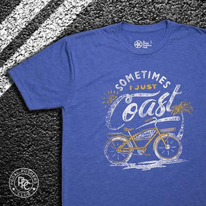 Blue t-shirt with graphic of classic cruiser bike and the text: "sometimes I just coast".