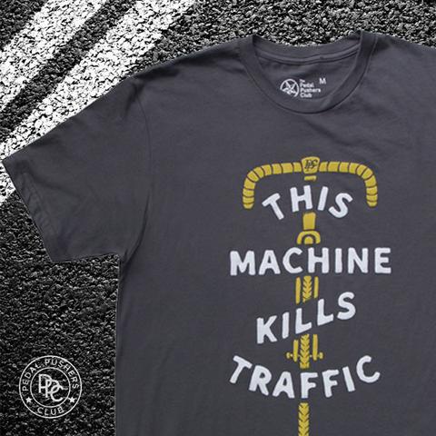 Gray t-shirt with yellow bike illustration and text: "This Machine Kills Traffic".