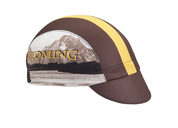 Wyoming Technical 3-Panel Cycling Cap. Brown cap with yellow stripe and Grand Teton imagery on side.  Angled view.