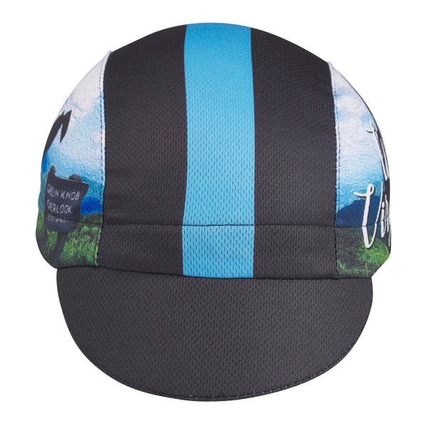 West Virginia Technical 3-Panel Cycling Cap. Black cap with light blue stripe.  West Virgina outline and Green Knob Overlook image on side. Front view.