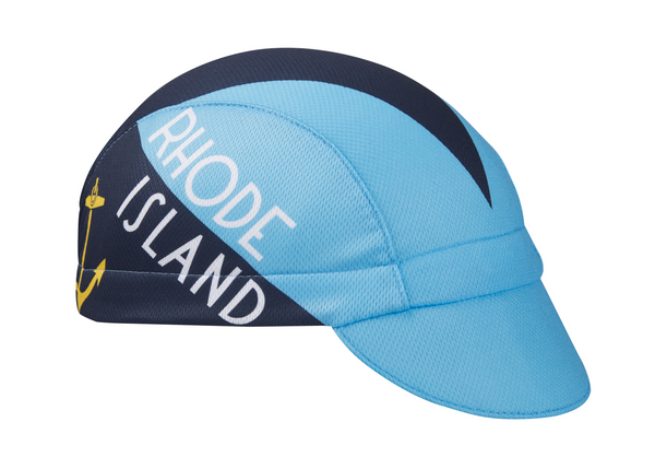 Rhode Island Technical 3-Panel Cycling Cap.  Baby blue and navy blue cap with RHODE ISLAND text and anchor imagery on side. Angled view.