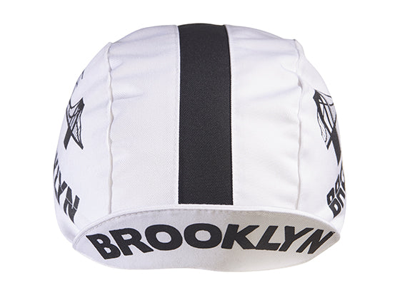 Brooklyn White Cotton 3-Panel Cycling Cap with Black Stripe.  Brooklyn bridge logo and Brooklyn text on side and brim. Brim up front view.