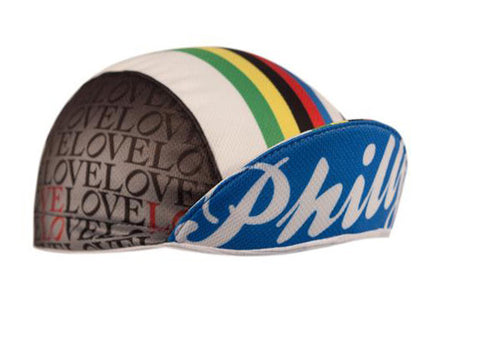 Philadelphia Technical 3-Panel Cycling Cap.  White, blue, and black cap with green, yellow, black, red, and blue stripes on top and LOVE print on side.  Philly text under brim.  Brim up angled view.