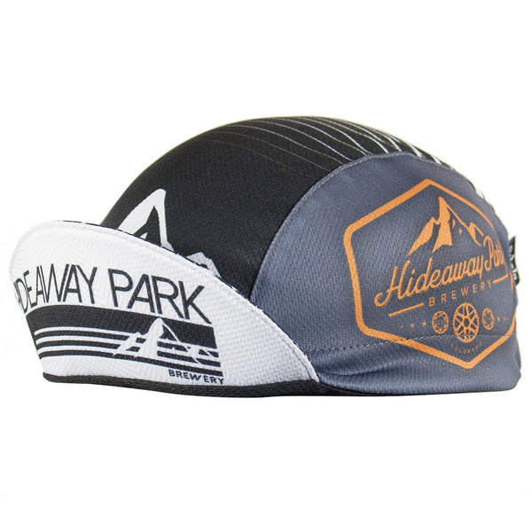 Hideaway Park Brewery Technical 3-Panel Cap.  Black and gray cap with mountains on front and brim and Hideaway Park Brewing logo on the side.  Brim up angled view.