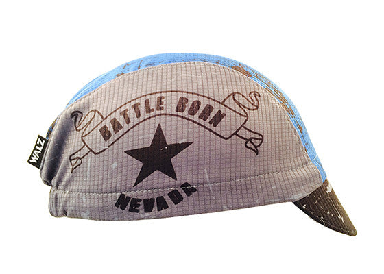 Nevada 3-Panel Technical Cycling Cap.  Gray, blue, and black cap with Nevada Battle Born text on side.  Side view.